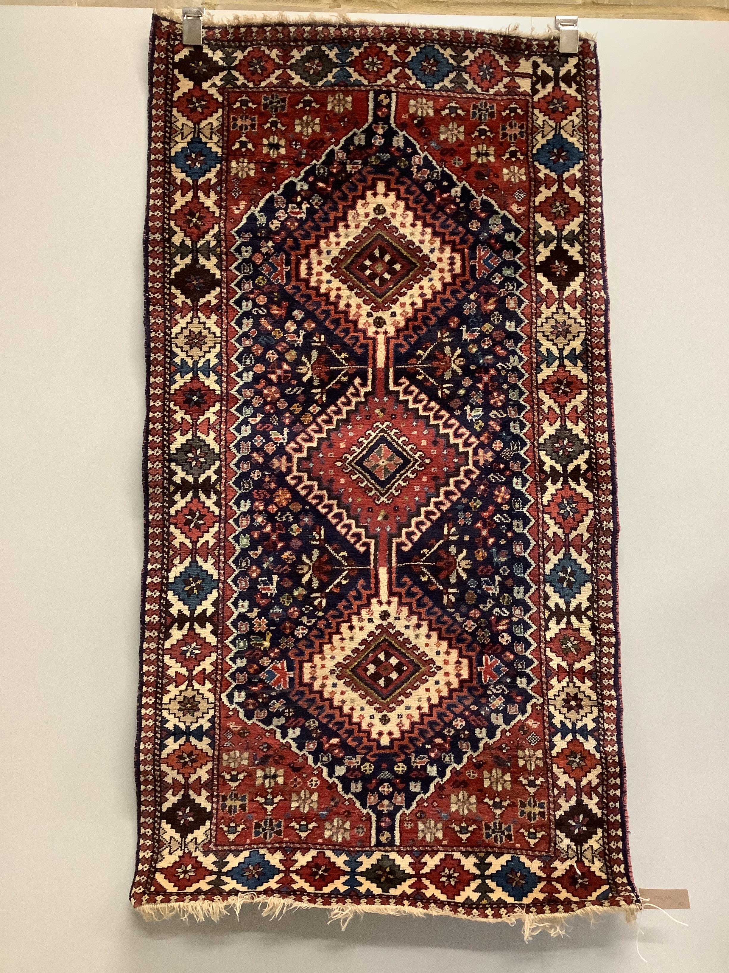 A Caucasian style blue ground rug, 146 x 78cm